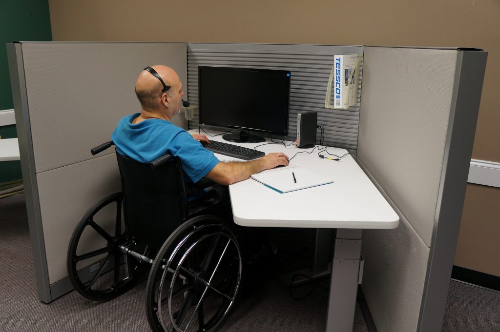 disabled man at computer